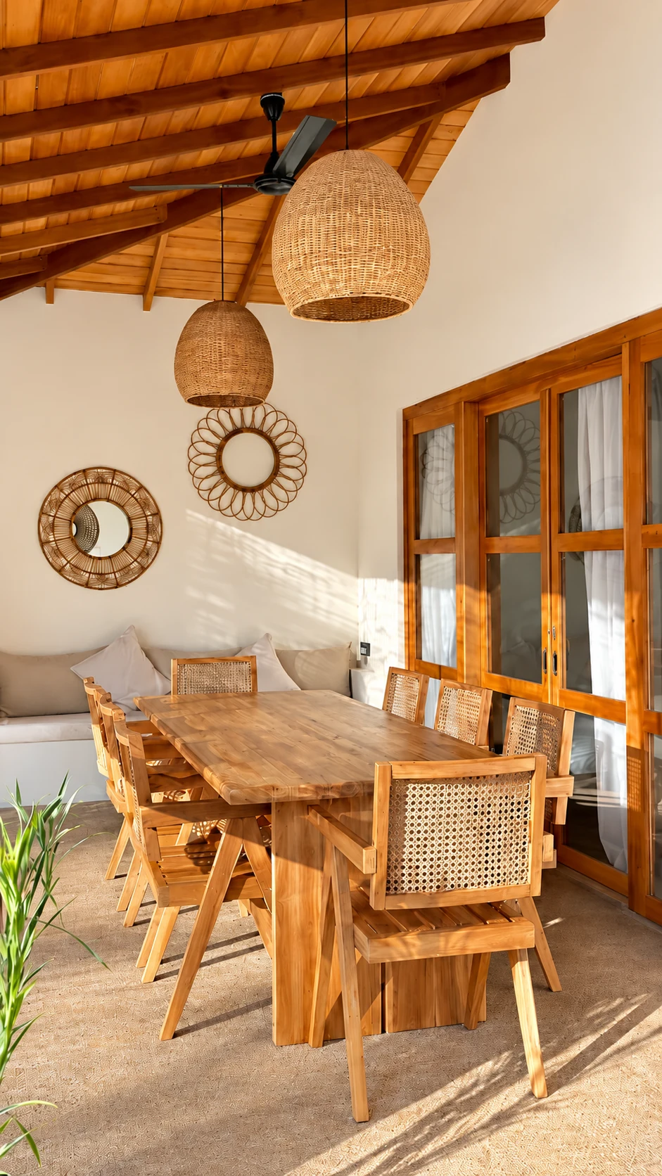 Covered outdoor dining table with a large teak table, and tropical surroundings at The Nest Sri Lanka near Hiriketiya beach.