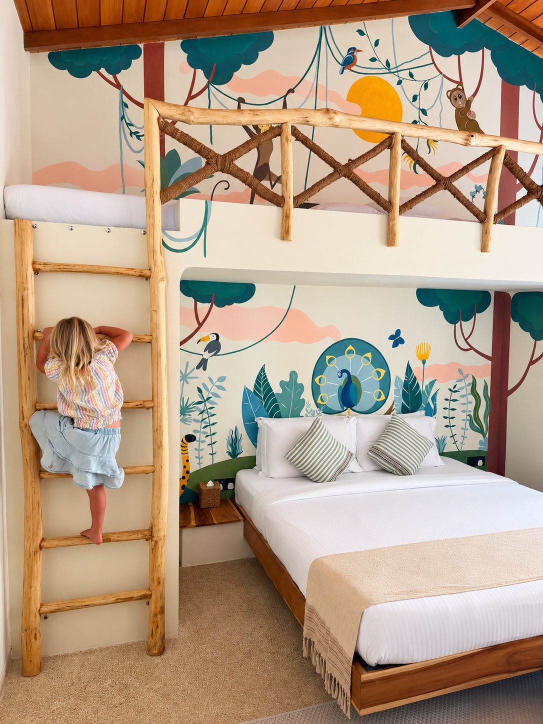 Family bedroom with a childrens loft, ladder and jungle mural at The Nest Sri Lanka near hiriketiya beach.