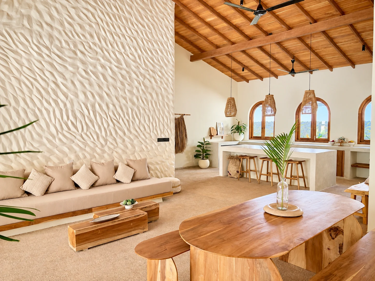 Open plan living and dining area with vaulted timber ceiling, textured feature wall and tropical design at The Nest Sri Lanka near Hiriketiya beach.