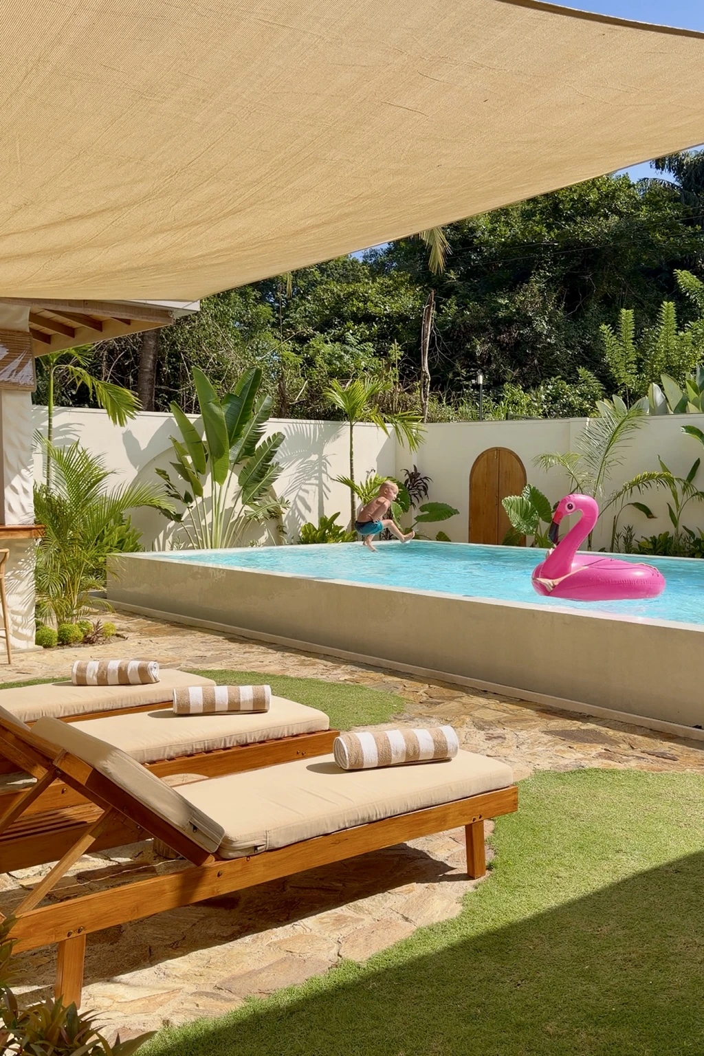 Family friendly private pool with sun loungers and tropical garden at The Nest Sri Lanka near Hiriketiya beach.