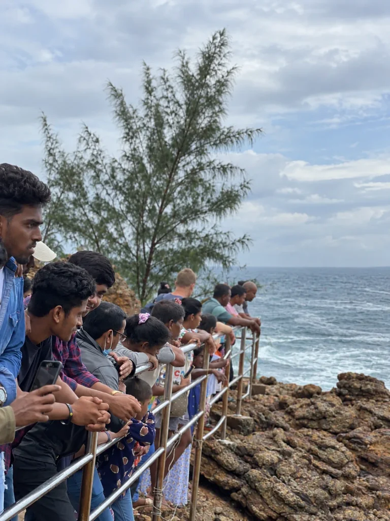 People watch and wait for the Hummanaya Blowhole at the viewing area.